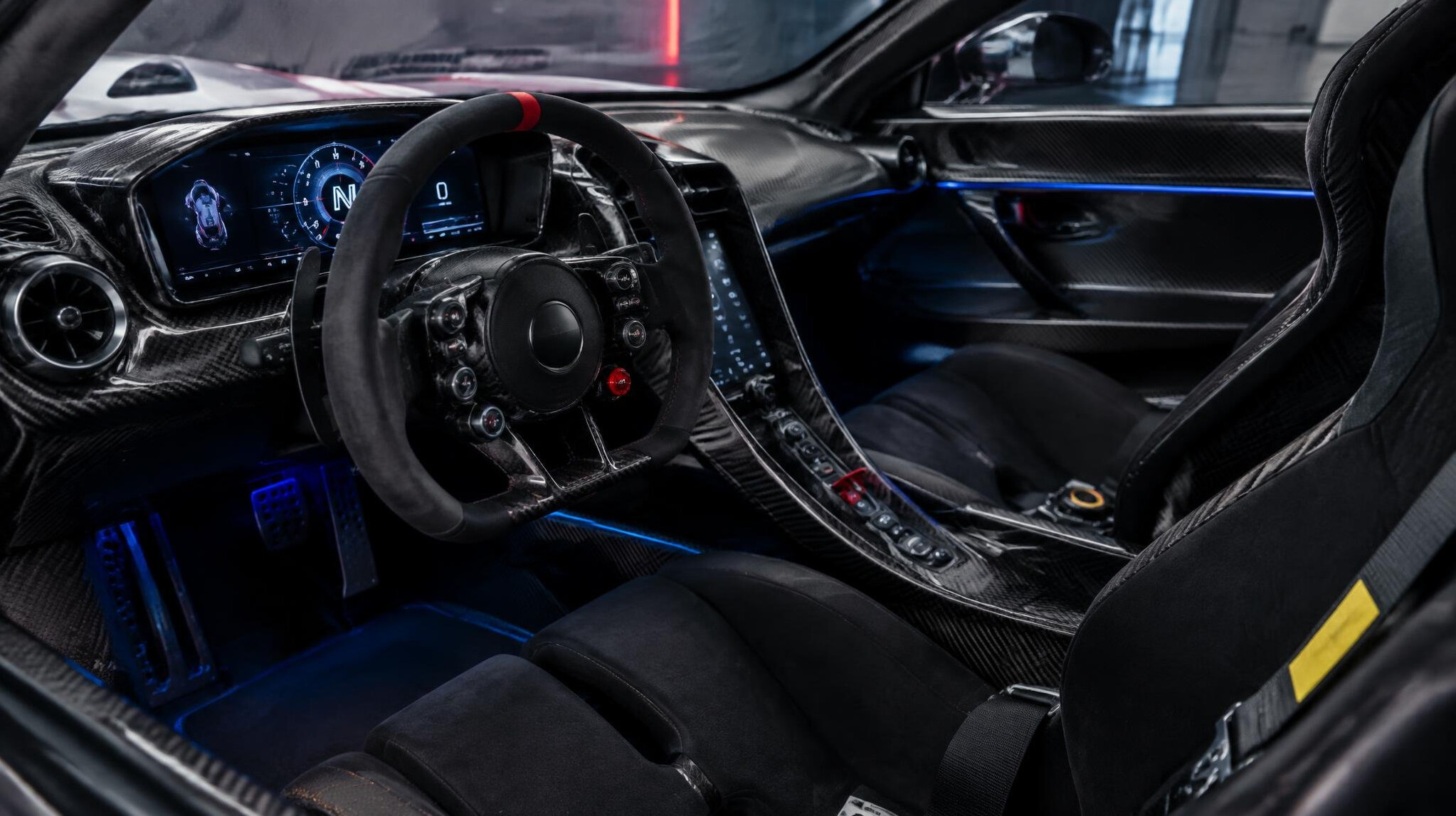 Interior cockpit of a modern hypercar with carbon fiber and racing seats